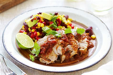 Remove orange halves, onion, and bay leaves from the liquid and discard. . Mexican braised pork dish crossword